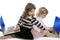 Two little girls sister with computer laptops