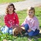 Two little girls sister friends golden retriever