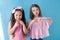 Two little girls are sisters girlfriends in a pink dress