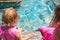 Two little girls splashing water