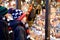 Two little kid boys selecting decoration on Christmas market. Beautiful siblings and best friends shopping for toys