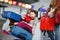 Two little kids, boy and girl, siblings and mother at the airport. Children, family traveling, going on vacation by