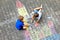 Two little kids boys drawing knight castle with colorful chalks on asphalt. Happy siblings and friends having fun with