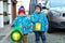 Two little kids boys holding selfmade lanterns for a Halloween or St. Martin procession. Beautiful brothers, cute