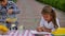 Two little kids are selling lemonade at a homemade lemonade stand on a sunny day with a price sign for an entrepreneur