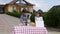 Two little kids are selling lemonade at a homemade lemonade stand on a sunny day with a price sign for an entrepreneur