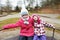 Two little laughing kids girls on carrousel