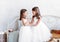 Two little pretty girls play fun in a light room. Funny lovely children are having fun