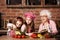 Two little sisters with granny cooking together