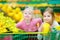 Two little sisters shopping in a food store