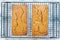 Two Loaves of Pumpkin Bread over Marble Background