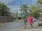 Two local malagasy girls are walking on the street