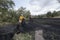 Two local women pull huge black nets full of olives; jaÃ©n Spain