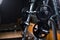 Two long barbells on a stand. Barbell holder on a blurred gym background. Heavy, huge black dumbbells. Sport equipment.