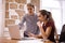 Two lovely young business women concentrating