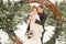 Two lovers, a man and a woman, a wedding in winter. bride and groom love. against the backdrop of decor and trees, snow. holding a