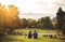 Two lovers sitting on green grass, Prague, august 2015