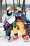 Two loving amorous snowboarders resting on the top of the ski slope