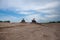 Two lucky people on quad bikes on sand surface in spring.