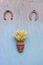 Two lucky symbol horseshoe and basket with wheat ears on wall