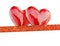 Two luxury red hearts with ribbon on white background. Happy Valentines day. Glitter love confetti.