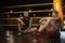 Two male boxers working out together at boxing gym