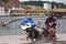 Two male buskers singing and playing guitars