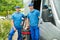 Two Male Cleaners With Vacuum Cleaner