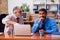 Two male employees playing cards at workplace