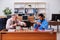 Two male employees playing cards at workplace