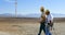 Two male engineer walking in the wind farm 4k