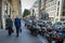 Two male executives walk along Rue de Turbigo in Paris, France
