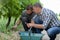 Two male farmer picking grapes