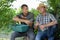 Two male farmers having break