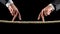 Two male hands making the walking sign on a rope