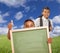 Two Male Hispanic Students with Thumbs Up and Chalk Board