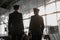 Two male pilots standing in airport terminal