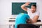 Two male pupils in bullying concept in the classroom