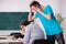 Two male pupils in bullying concept in the classroom