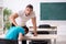 Two male pupils in bullying concept in the classroom