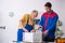 Two male repairmen working at workshop