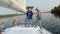 Two male sailors on deck of sailing yacht, friends, vacation