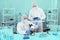Two Male Scientists in PPE Suit working in Lab while Checking Result of Blood Sample testing.