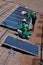 Two male solar workers install solar panels
