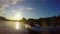 Two male tourists paddling kayak at sunset, beautiful landscape