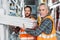 two male workers holding styrofoam