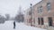 Two man busy cleaning snow and icicles on the roof