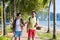 Two Man Using Cell Smart Phones Tropical Park Couple Chatting Online Holiday Sea Summer Vacation