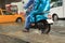 Two man wearing raincoat riding motorcycle