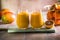 Two mango lassi or kesar milk in glasses. Indian healthy ayurvedic cold drink with mango. Freshness lassi made of yogurt, water,